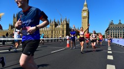 A picture of myself (Luc Shelton) in a SpecialEffect athletic jersey, running across the London Bridge. Behind me in the distance is the Palace of Westminster and Big Ben.
